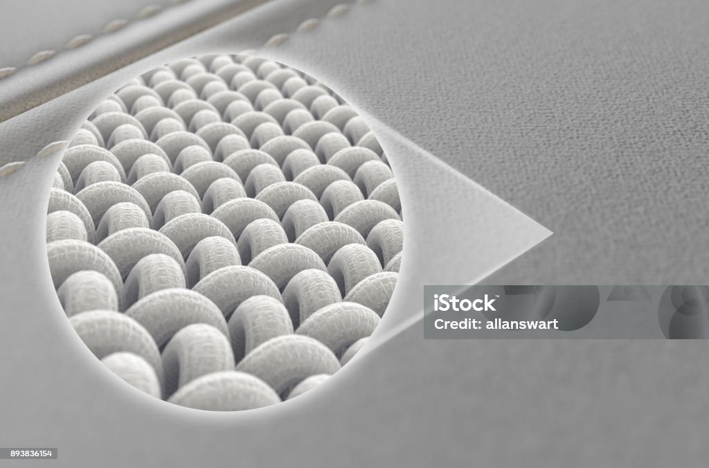 Canvas Material And Leather Label A close up view of two sections of a white canvas fabric stitched together and a microscopic zoomed insert showing the intrictae fabric weave pattern - 3D render Textile Stock Photo