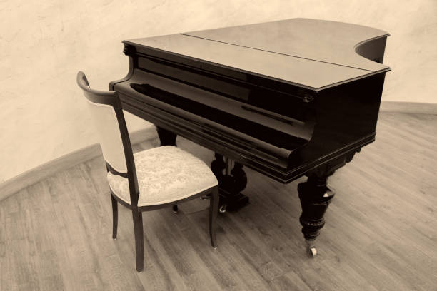 istock Black piano and chair 893846388