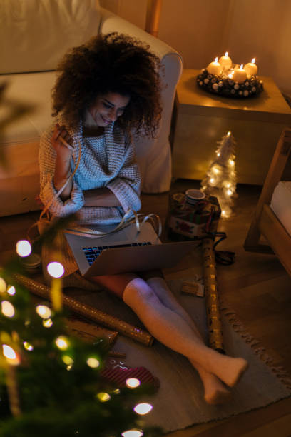 istock Colored girl packing presents 893862410