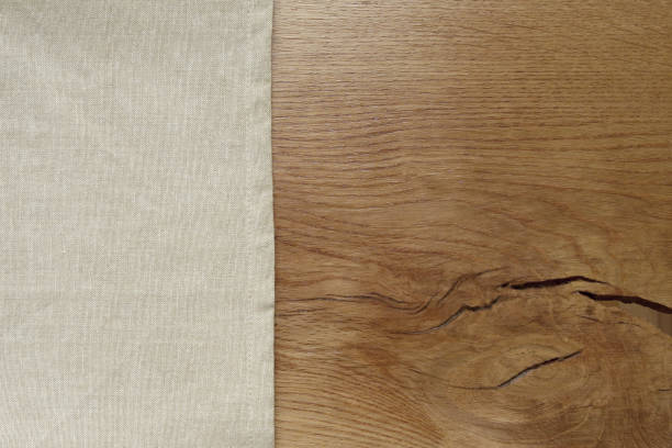 istock Linen tablecloth from left side wooden table. 893865558