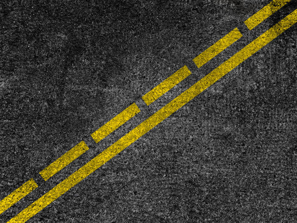 istock Asphalt road with dividing yellow lines. 893865876