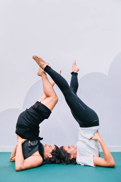 istock Young women exercise with legs up in the air 893895790