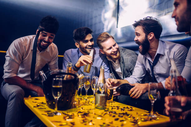 The night is just getting going Group of young men drinking at a nightclub stag night stock pictures, royalty-free photos & images