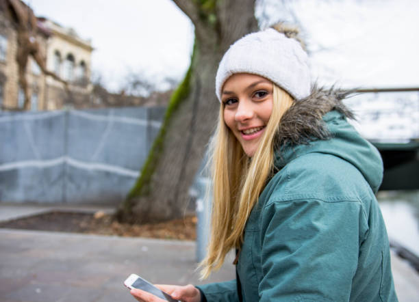 istock Woman using smart phone in the city 893917766