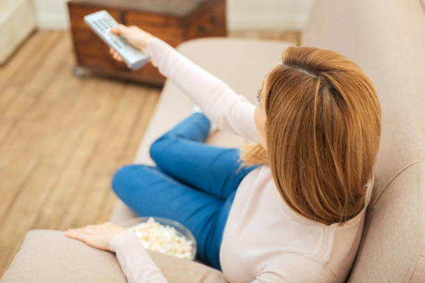 istock Long-haired woman relaxing on the sofa 893970512