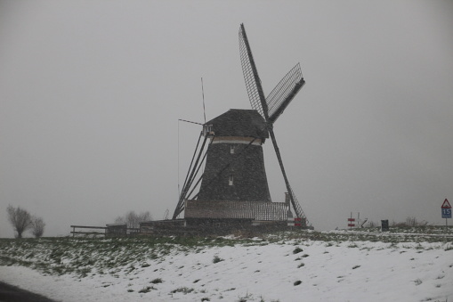 Dutch windmills located at the Tweemanspolder,Zevenhuizen during a snow storm