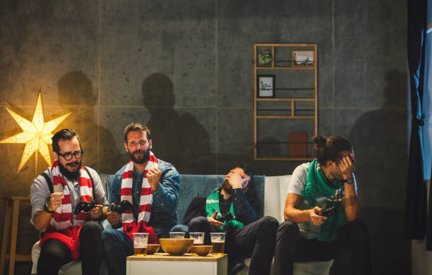 istock Men Socializing at Home - Playing Video Games 893983232
