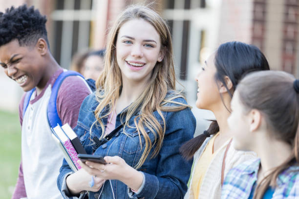 istock Group of diverse teenagers before school 893988444