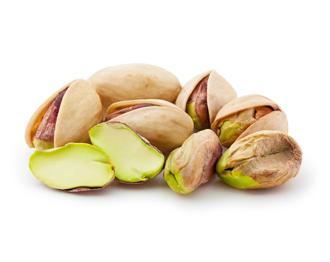 Raw pistachios isolated on white