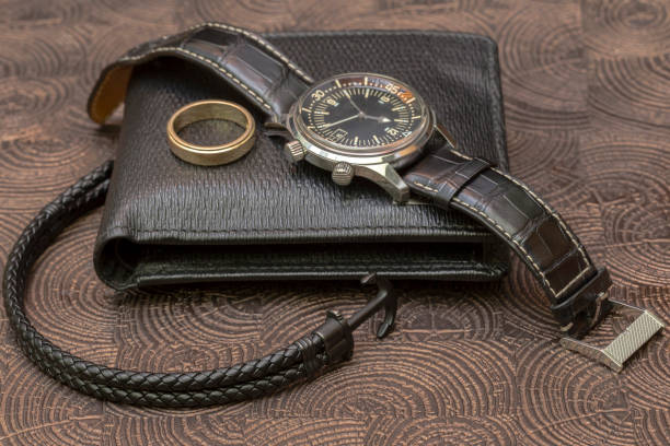 istock a business man leather accessory, closeup. Wallet, strap, handstrap and mobile phone with case 894021212