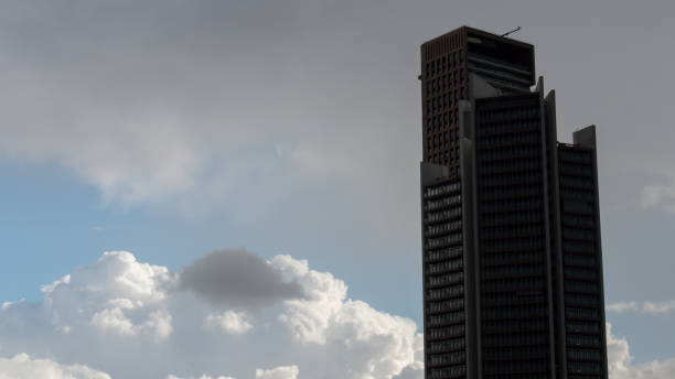 istock Corporate building at fluffy clouds background 894036946