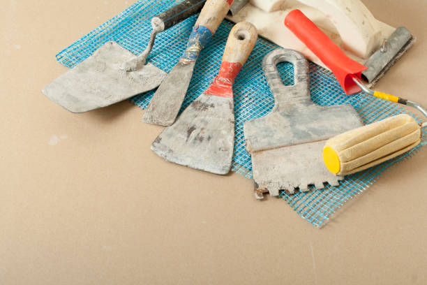 istock Set of assorted plaster trowel tools and spatula.Top view.Copy space for text. 894037092
