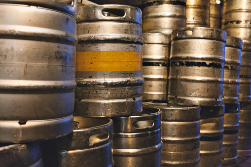 Full frame shot of stacks of beer kegs.