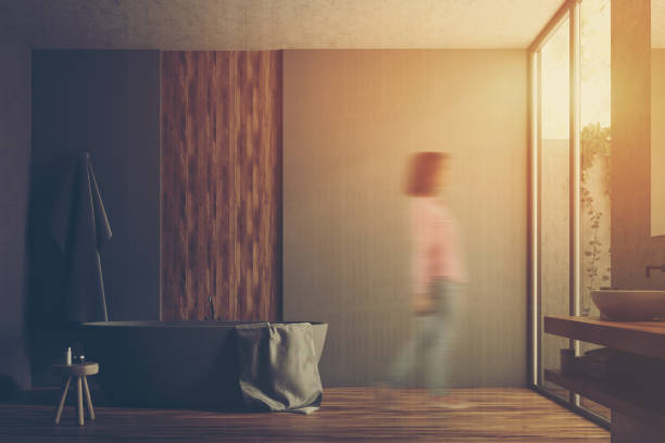 istock Gray and wooden bathroom interior toned 894044958
