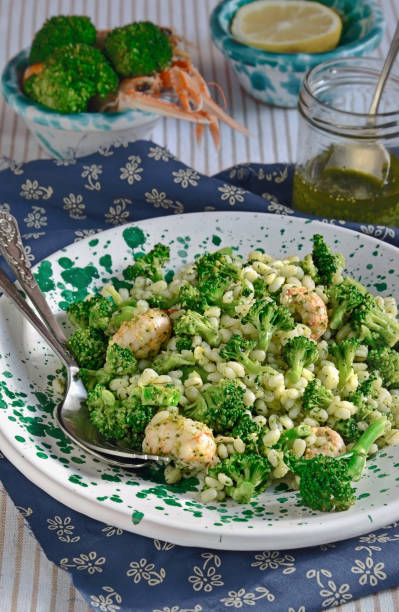 Broccoli Barley Salad with Shrimp Scampi. Seafood Recipes. stock photo