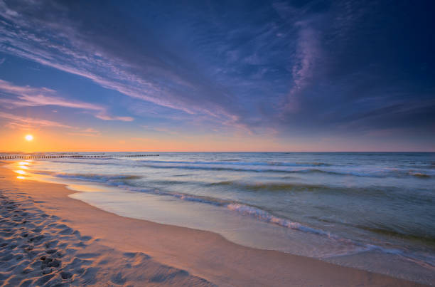 istock Dramatic sky at sunset over the Baltic Sea 894045178