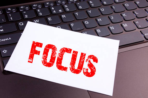 istock Writing Focus text made in the office close-up on laptop computer keyboard. Business concept for Attention Success Concentrate Workshop on the black background with copy space 894051284