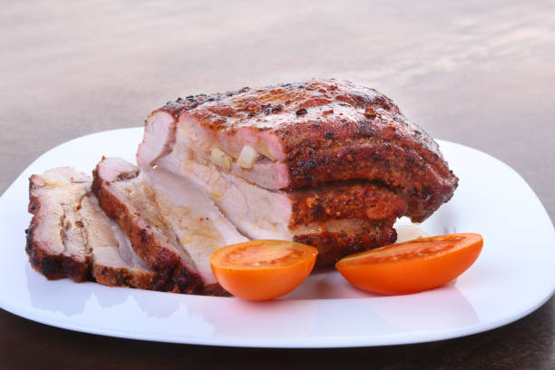 istock grilled pork chops with tomato and ketchup on plate. 894055332