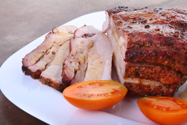 istock grilled pork chops with tomato and ketchup on plate. 894057802