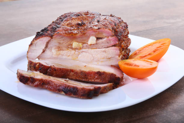 istock grilled pork chops with tomato and ketchup on plate. 894057854