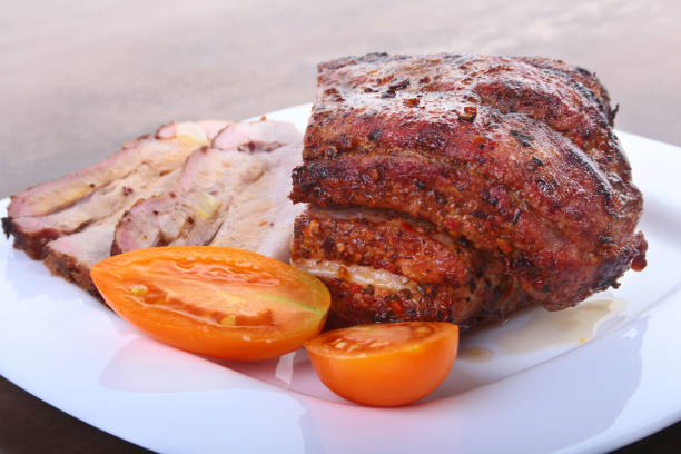 istock grilled pork chops with tomato and ketchup on plate. 894057950