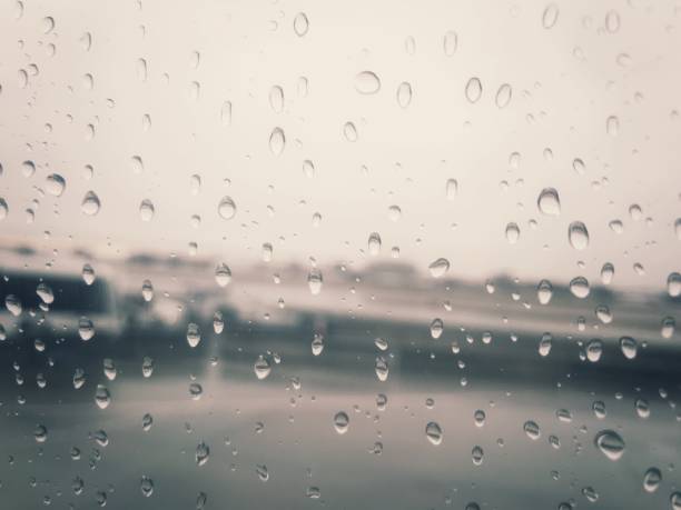 istock An airport on a rainy day, as shot through a plane window. 894058288