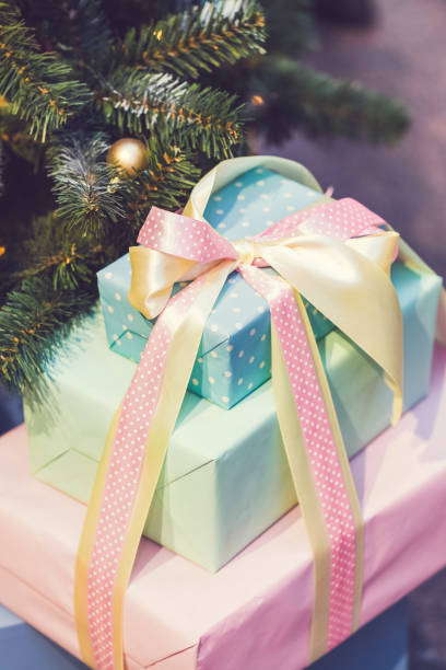 istock Beautiful boxes with gifts under a decorated Christmas tree 894058418