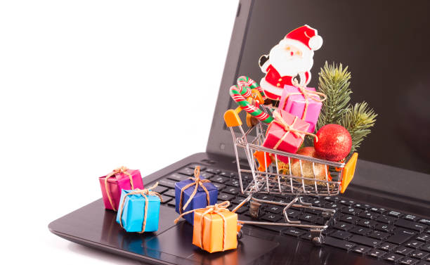 istock gift box and shopping cart on the laptop keyboard 894068938