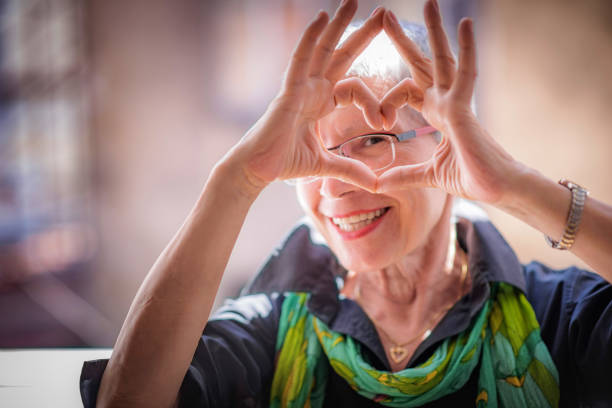 Senior woman sending love