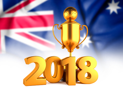 Sport Background with Sport Background with Golden Winner Trophy Cup and 2018 text against the national flag of Australia