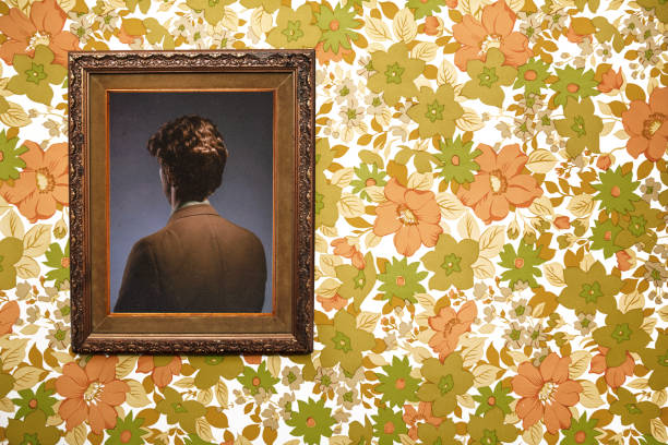 Bizarre Backwards Vintage Portrait A picture frame hangs on a wall with an ornate frame and retro style, the person posing in the portrait facing the wrong direction, only the back of their head and body visible. Floral wallpaper background.  Horizontal with copy space. back of head photos stock pictures, royalty-free photos & images