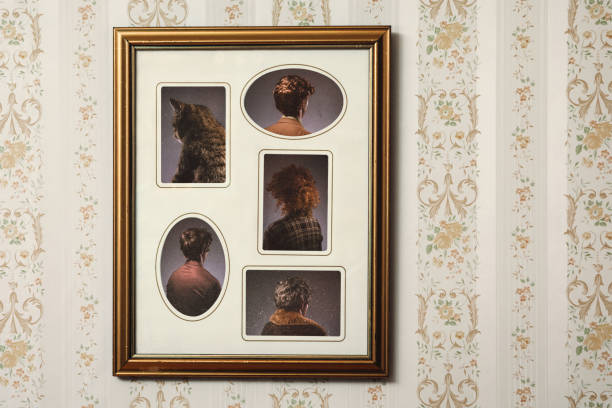 Bizarre Backwards Vintage Portrait A picture frame hangs on a wall with an ornate frame and retro style, the people posing in the portrait facing the wrong direction, only the back of their heads and bodies visible.  Horizontal with copy space. back of head photos stock pictures, royalty-free photos & images