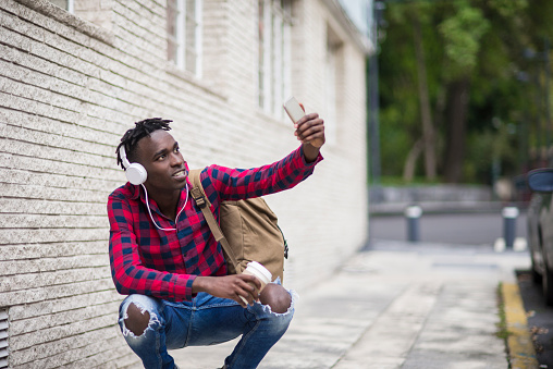 Smiling African student making a selfie