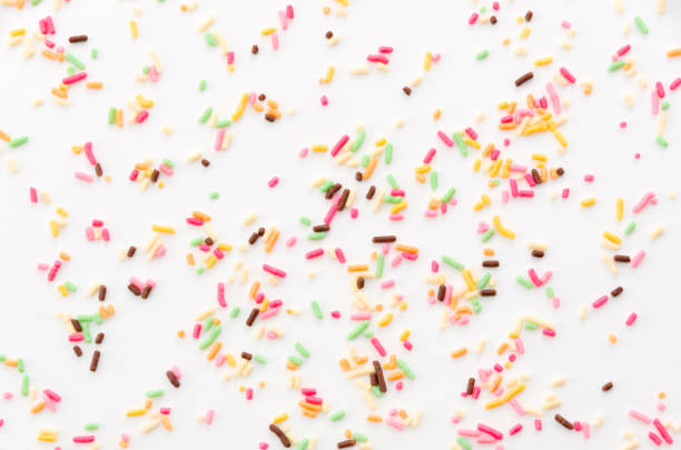 istock Colored sprinkles,decoration for cake and bekery, Colored sprinkles white background, 894091344