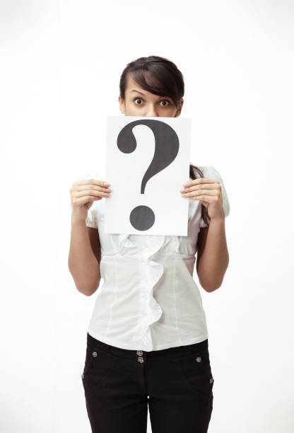 istock young business woman showing a question mark 894094672