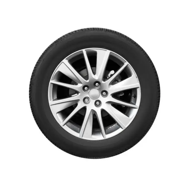 Modern car wheel on light alloy disc, front view isolated on white background
