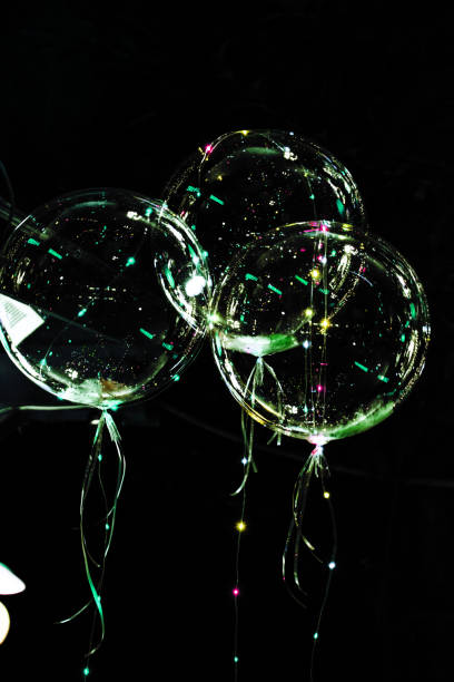istock big beautiful gel balloons, painted lights and light bulbs. at night 894119782
