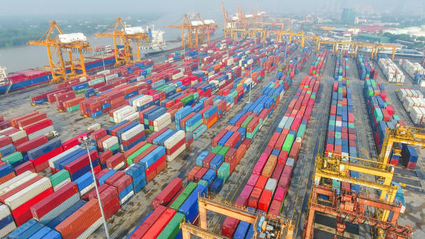 istock Logistics and transportation of Container Cargo ship and Cargo working crane bridge in shipyard 894135112