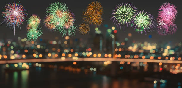 istock Colorful fireworks on blurred bokeh city night lights background 894141518