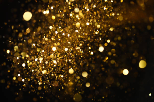 istock golden glitter texture Colorfull Blurred abstract background for birthday, anniversary, wedding, new year eve or Christmas. 894141730