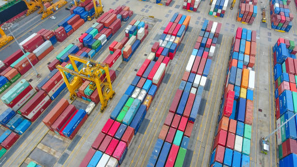 istock Logistics and transportation of Container Cargo ship and Cargo working crane bridge in shipyard 894143854