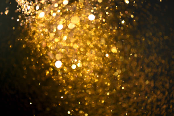 istock golden glitter texture Colorfull Blurred abstract background for birthday, anniversary, wedding, new year eve or Christmas. 894143972