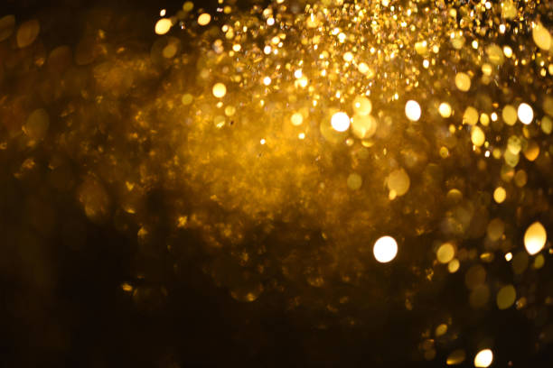 istock golden glitter texture Colorfull Blurred abstract background for birthday, anniversary, wedding, new year eve or Christmas. 894144312