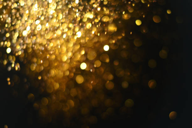 istock golden glitter texture Colorfull Blurred abstract background for birthday, anniversary, wedding, new year eve or Christmas. 894147530