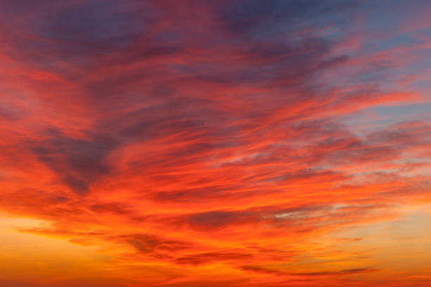 istock Beautiful vibrant red sunset sky view background image. 894150466