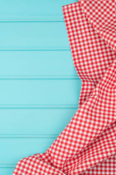 istock White and red towel over wooden table 894156750