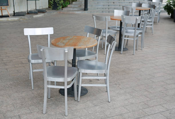 istock Circle wood table set with aluminium chair. 894159144