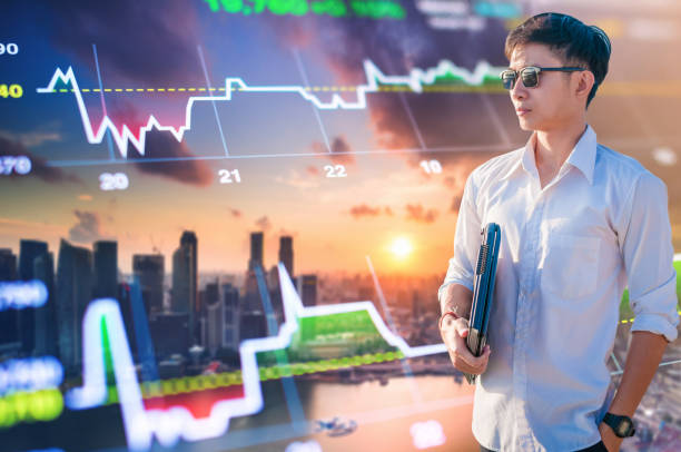 istock Asian business man using laptop and digital tablet in Singapore 894165908