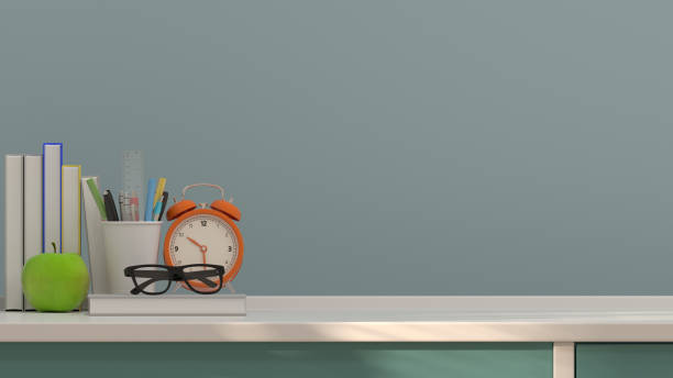 istock fruit apple and pen  and books table clock on the table colorful 3D rendering education concept in front of clean gray wall 894175356