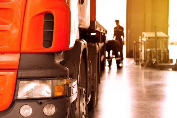 istock automobile mechanic checking truck in the garage with sunbeam, selective focus 894186570